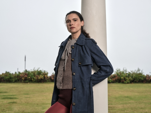 an image of a man and woman standing in a field