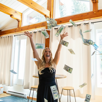 $100k giveaway winner throws a pile of cash in the air