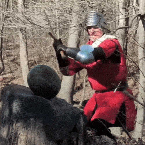 Man with sword cuts watermelon in half