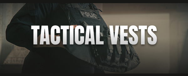 Officer in tactical vest aiming while clearing a stairwell