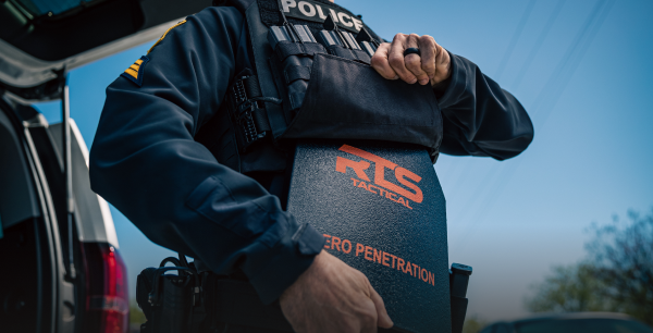Officer putting an RTS Tactical plate in a RTS plate carrier