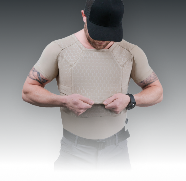 Man wearing RTS Tactical ballistic compression shirt adjusting front panel