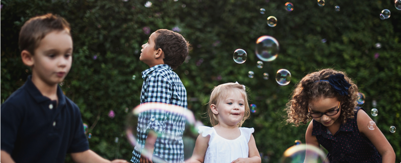 kids playing with bubbles