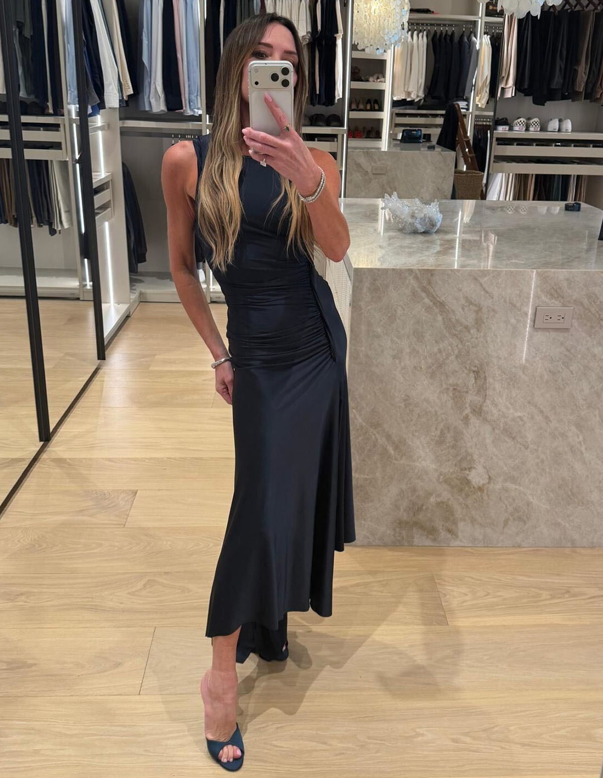 Victoria wearing the Twist Dress In Navy