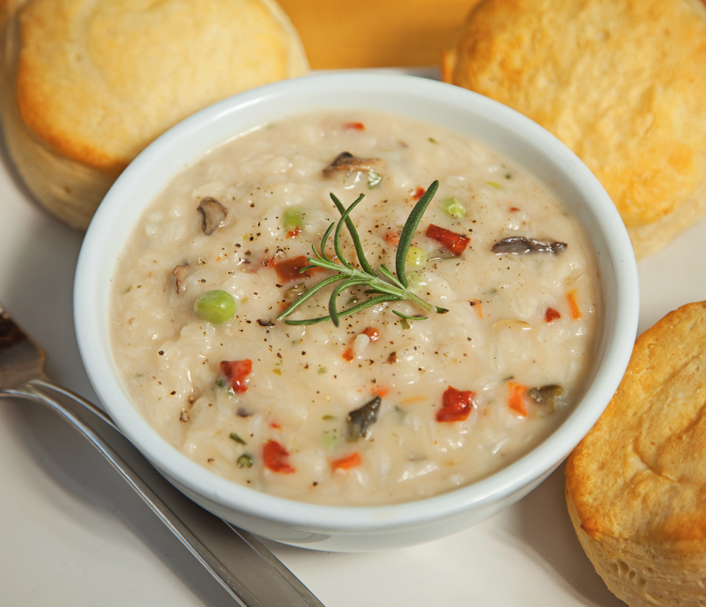 A close up of a gourmet bowl of Irish Pub Cheddar Soup