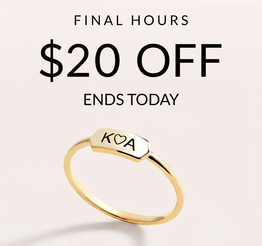 an image of a gold ring with a small square sign on it