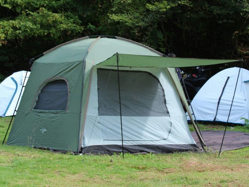 Cozy tent set up outdoors for an evening break