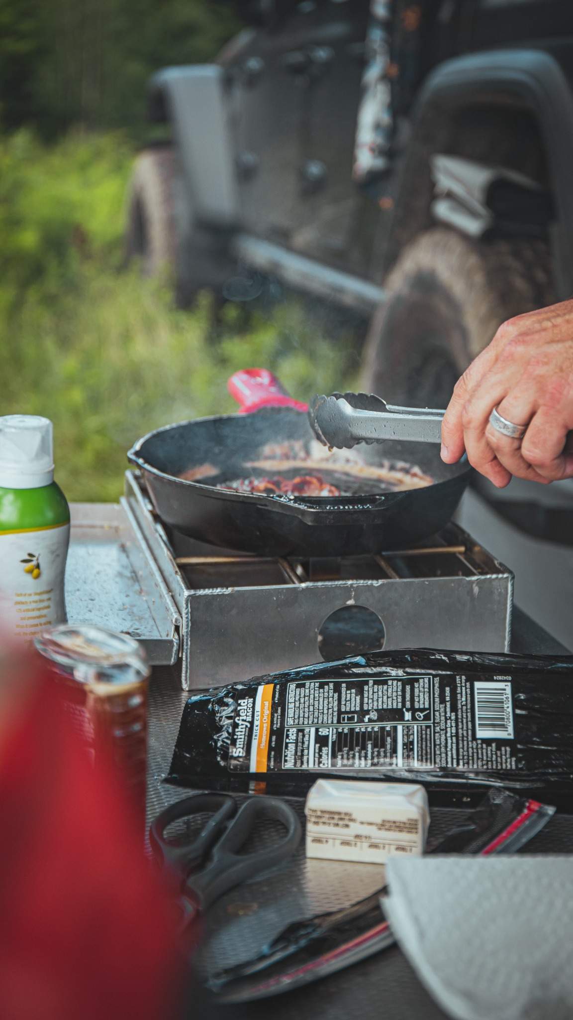 Camp kitchen setup with stove and safety equipment