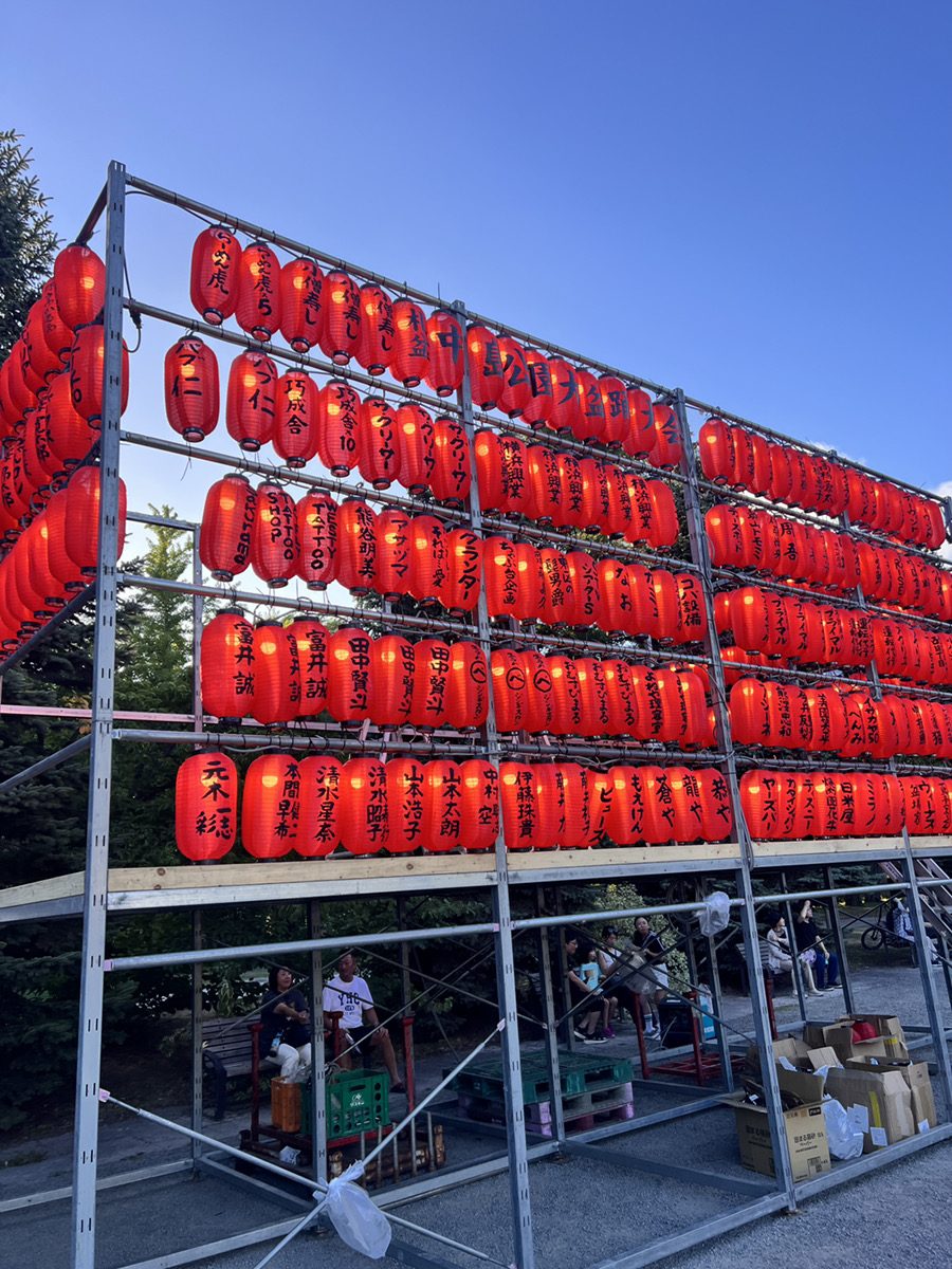 A wall of red lanterns at the edge of the park
