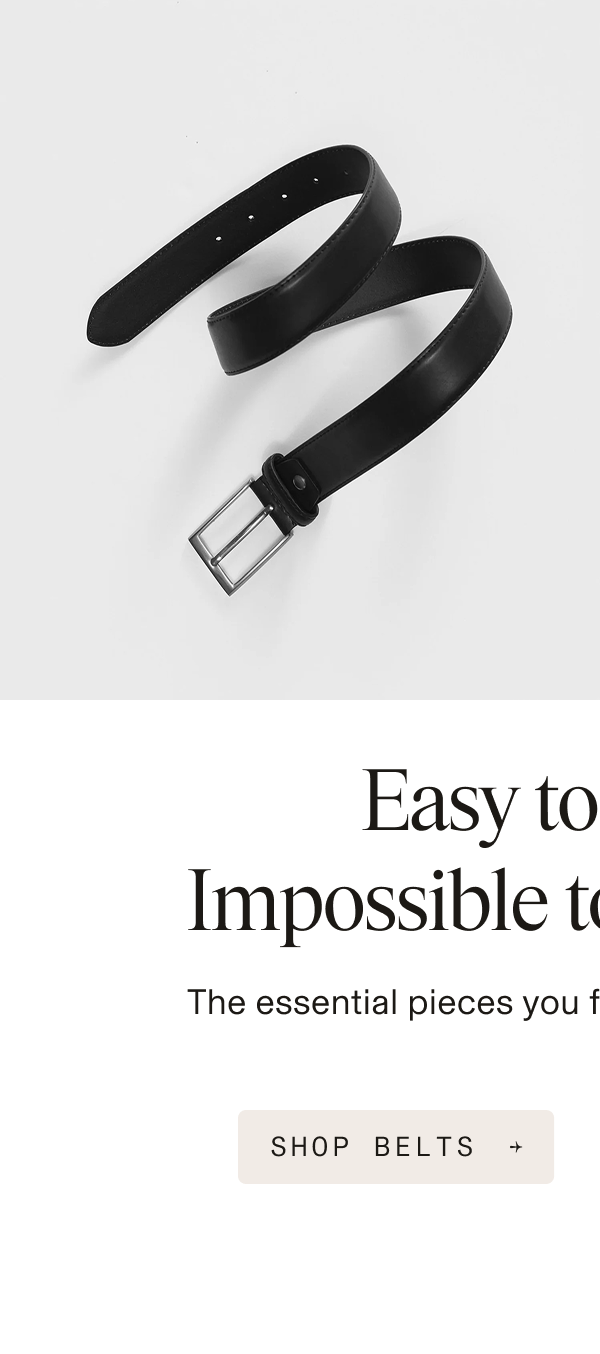 a black leather belt with a silver buckle, coiled loosely on a white background. Copy reads: "Easy to forget. Impossible to go without." followed by "The essential pieces you forget until the morning of." Below is a button reading "SHOP BELTS →"
