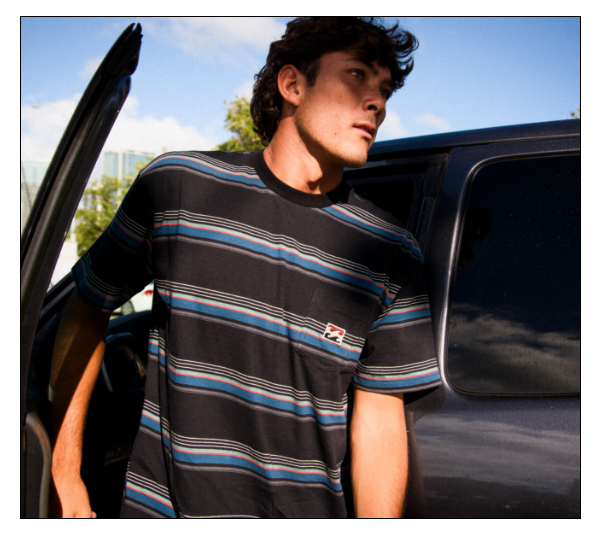 Billabong T-shirt on model getting out of a car