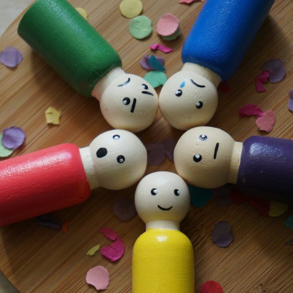Wooden dolls with different facial expressions