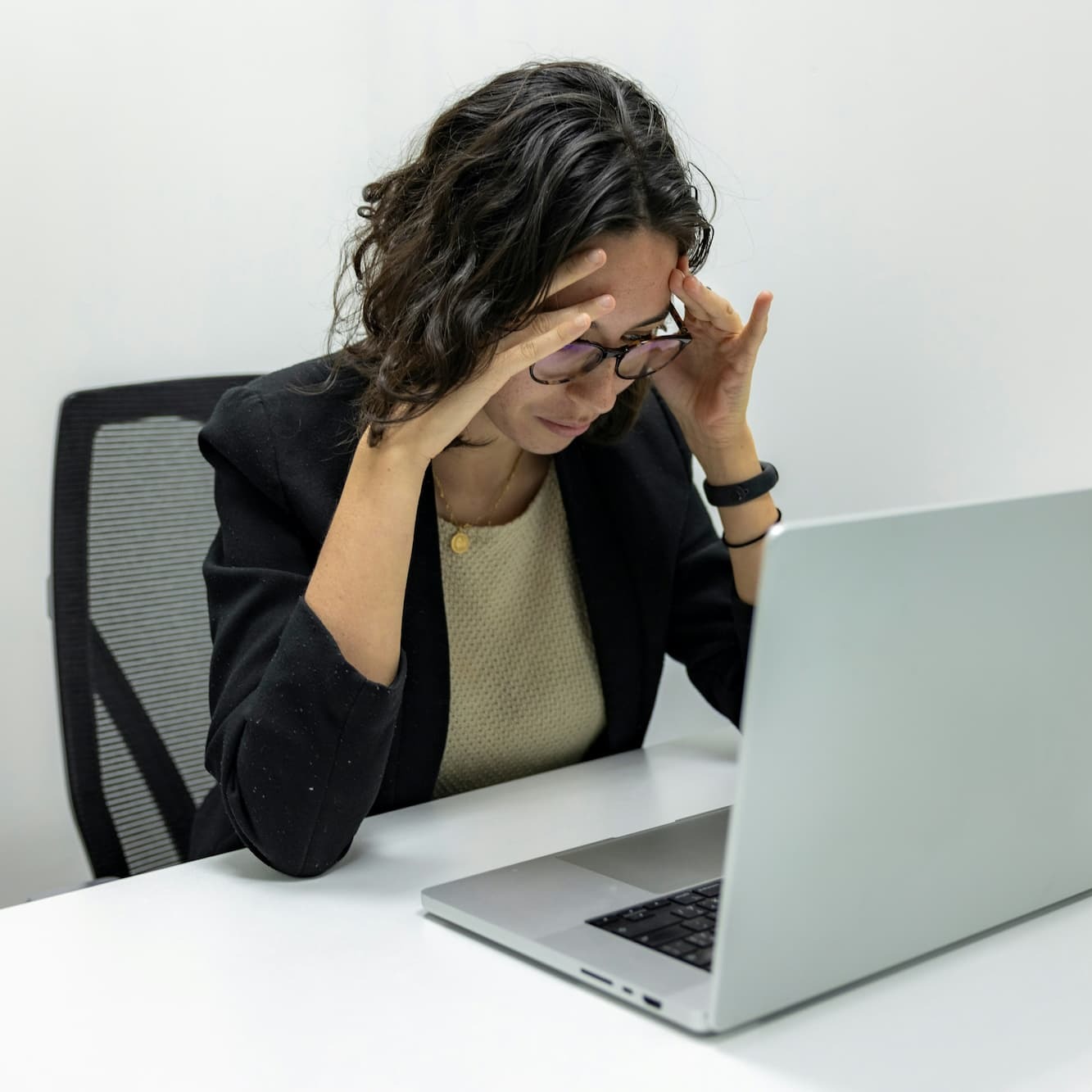 Stressed out woman at a laptop