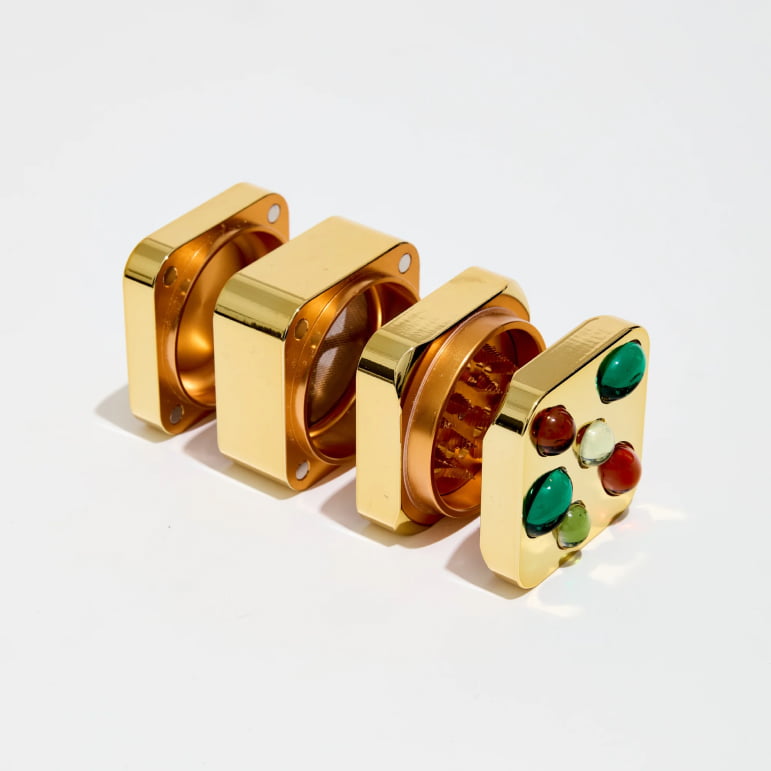 gemstoned grinder in gold