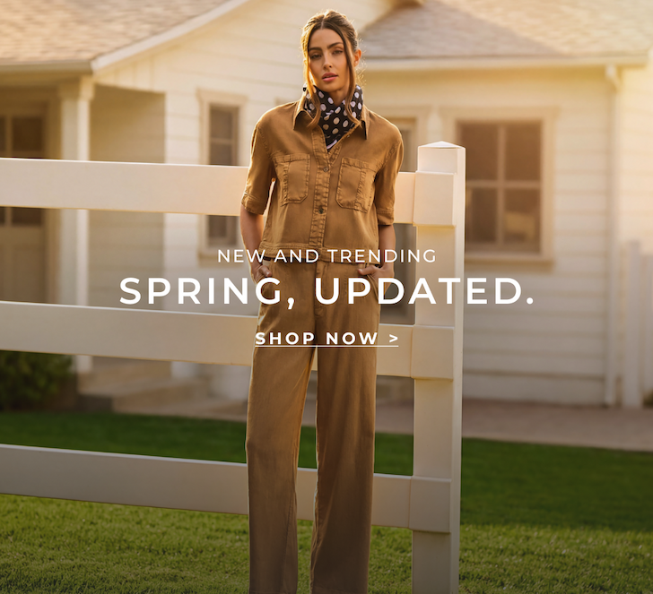 an image of a woman standing in front of a white fence