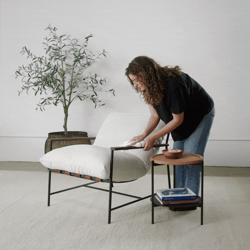 Image of woman cleaning and replacing a Vail Lounge Chair