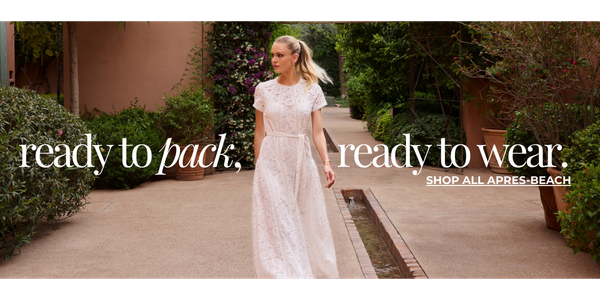 Model is wearing the Elara Dress in White