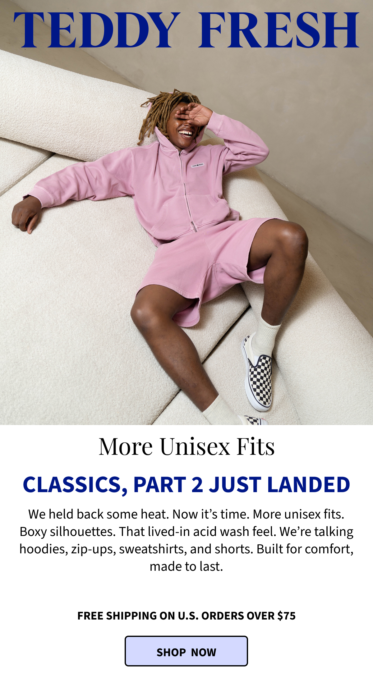 male model laying on the couch, laughing 
