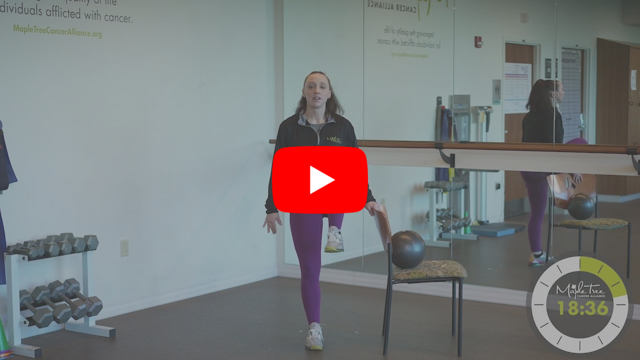 A young woman teaching an exercise class