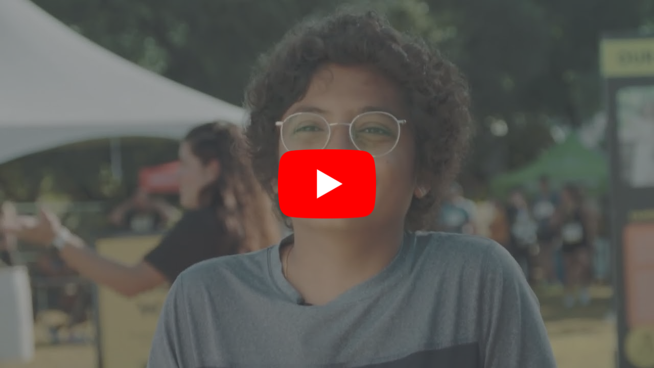 A boy with glasses speaking to the camera