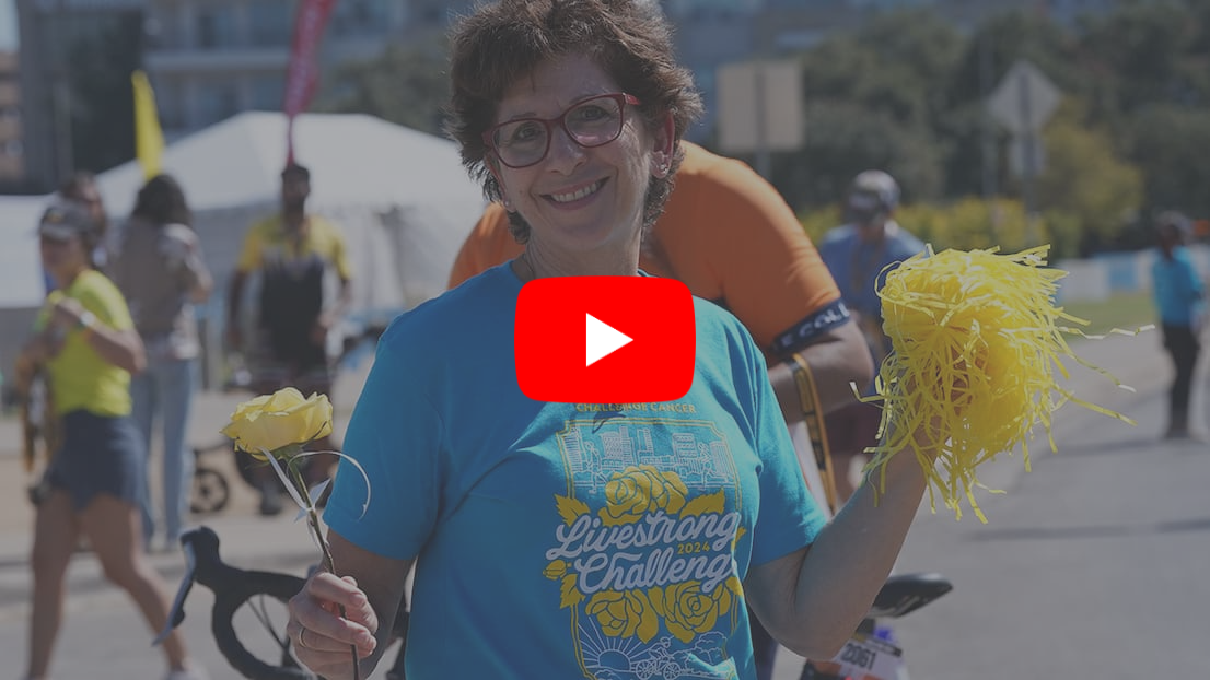 Woman holding a rose and pom pom