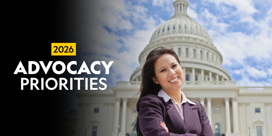 A woman smiling in front of the U.S. Capitol