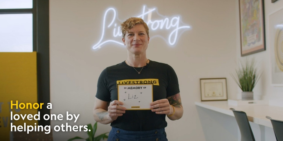 A woman holding a sign