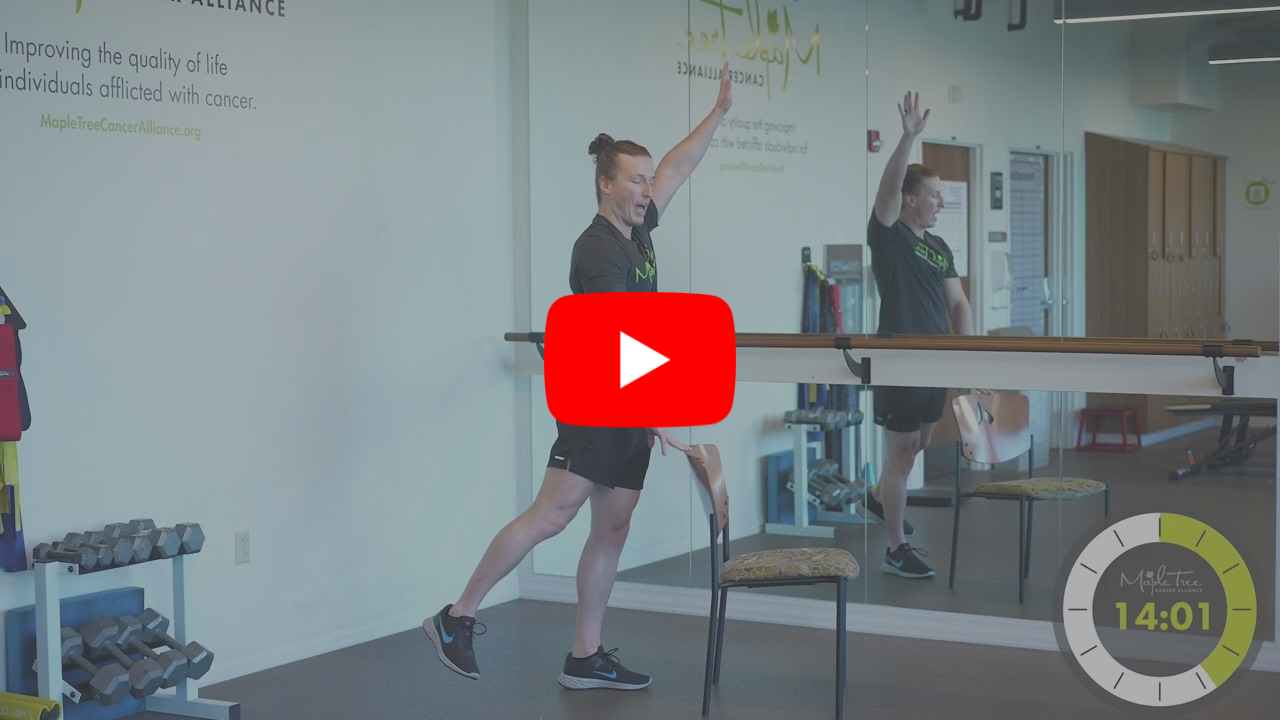 A man exercising with a chair