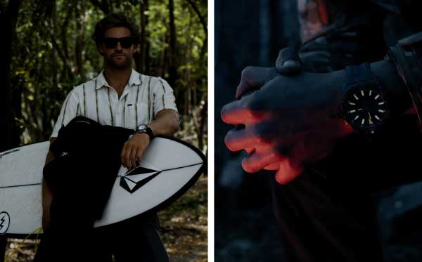 Man holding surfboard and watch at night