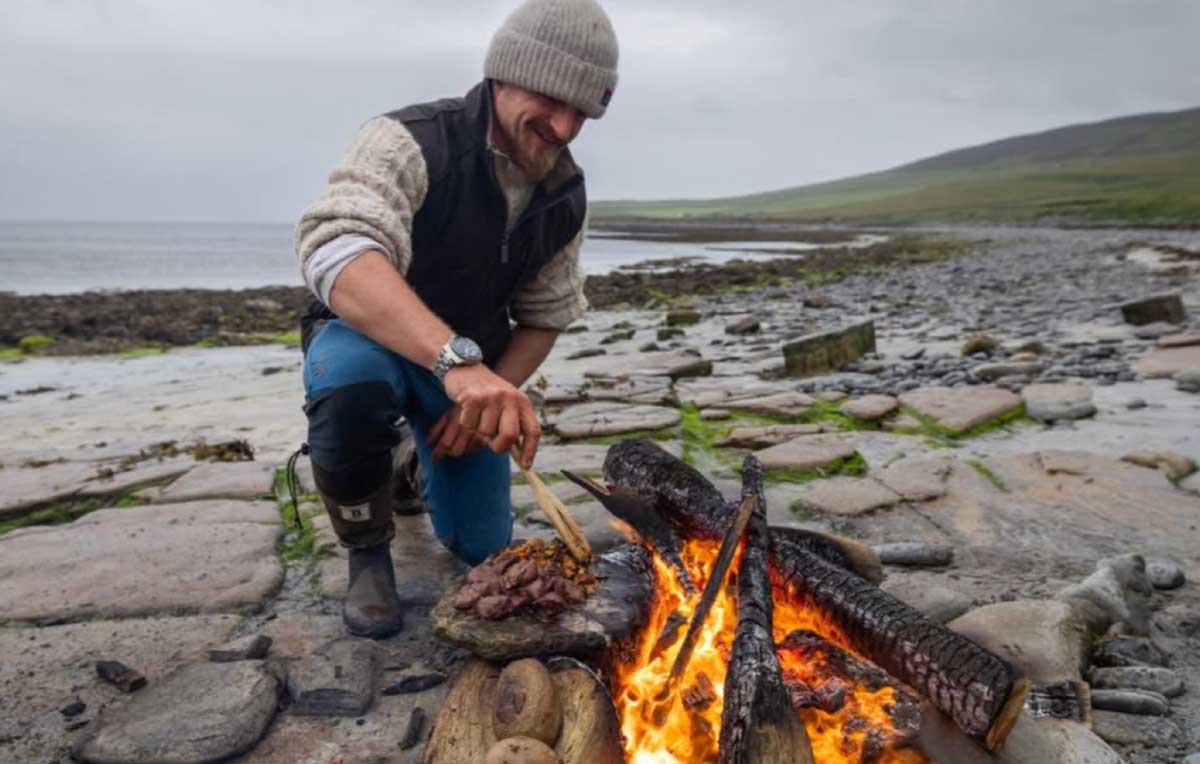 Man cooking in open fire