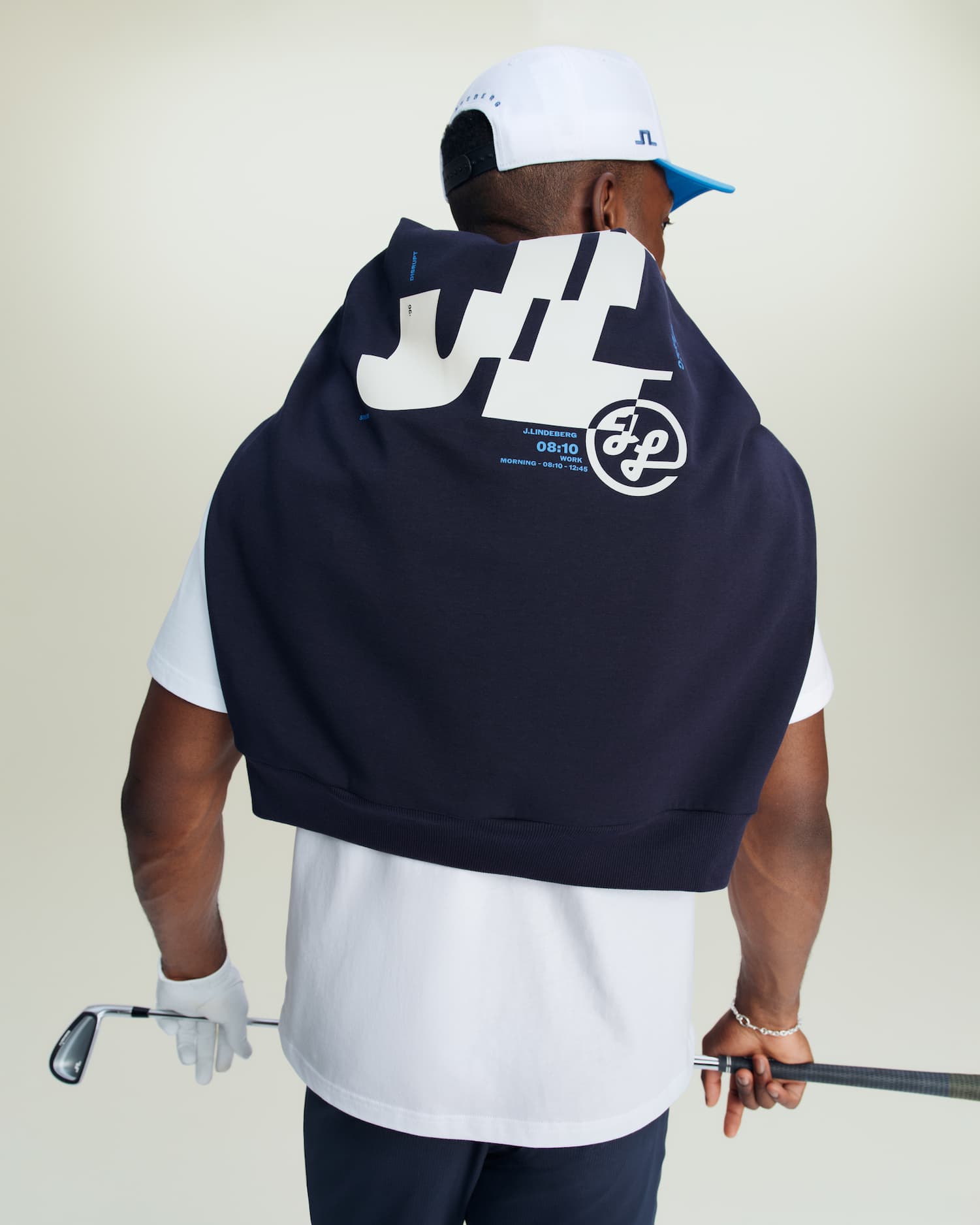 an image of a man holding a golf club and a golf ball
