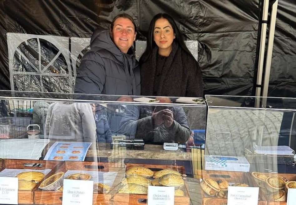 Oldham Council Leader Cllr Arooj Shah smiling with a market trader at Saddleworth Marina Pop Up Market