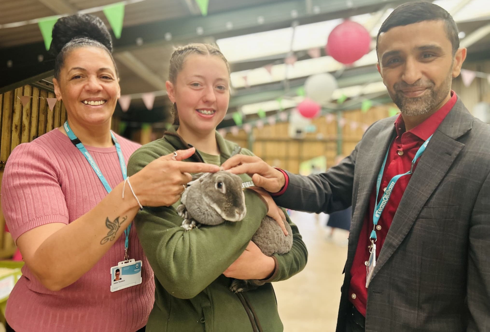 HAF Coordinator Adele Thomson and Cllr Shaid Mushtaq meeting a rabbit at Cockfields Farm Park