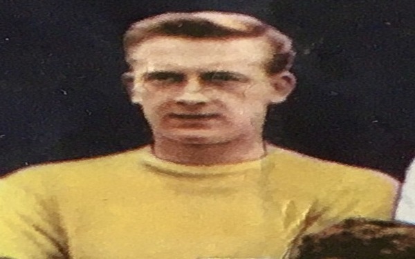 Goalkeeper Eddie Hopkinson in a yellow jersey