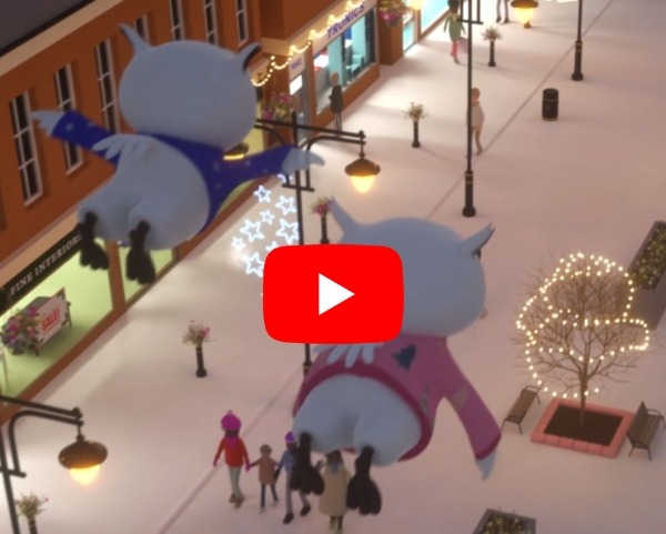 Two owls flying over Oldham town centre