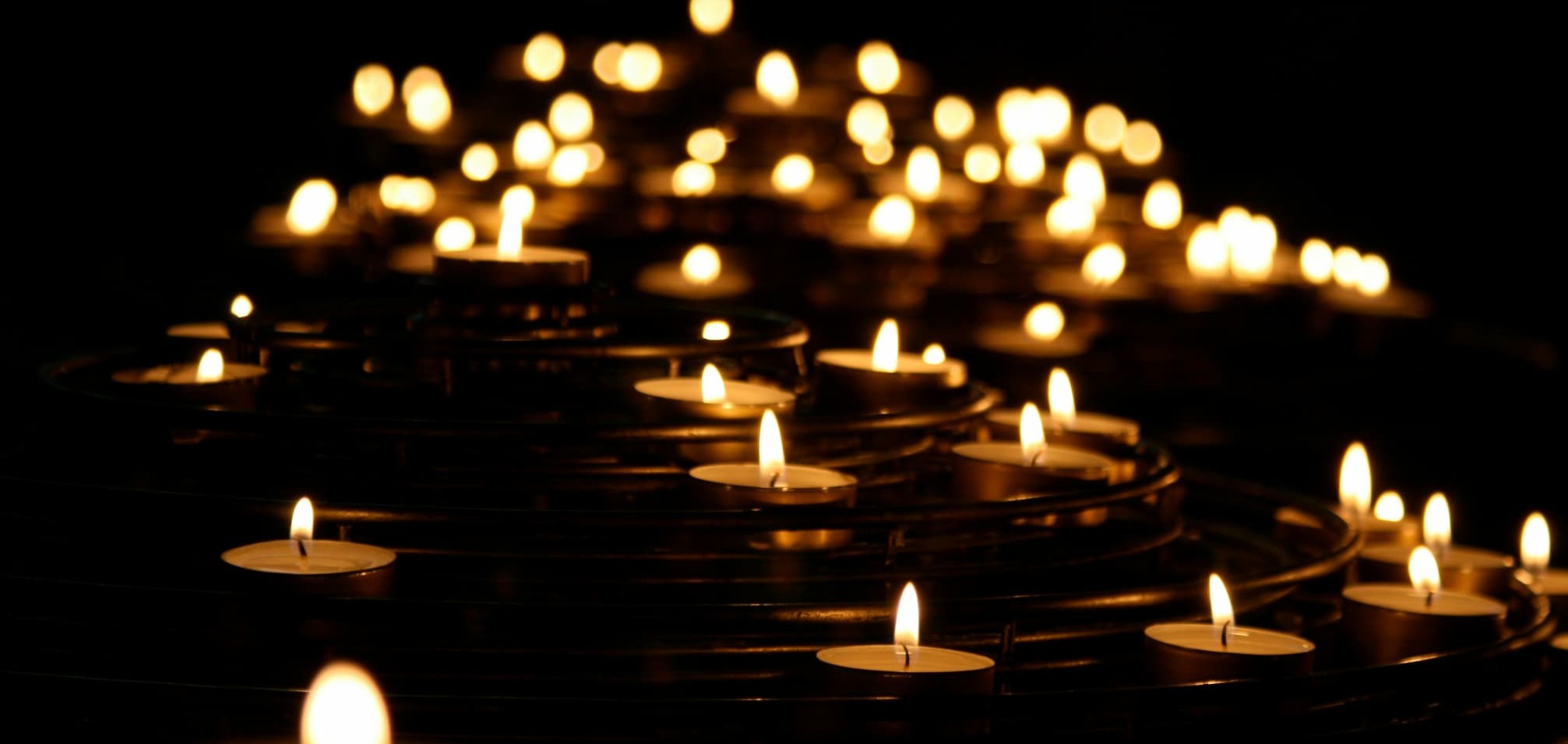 An arrangement of glowing tealights