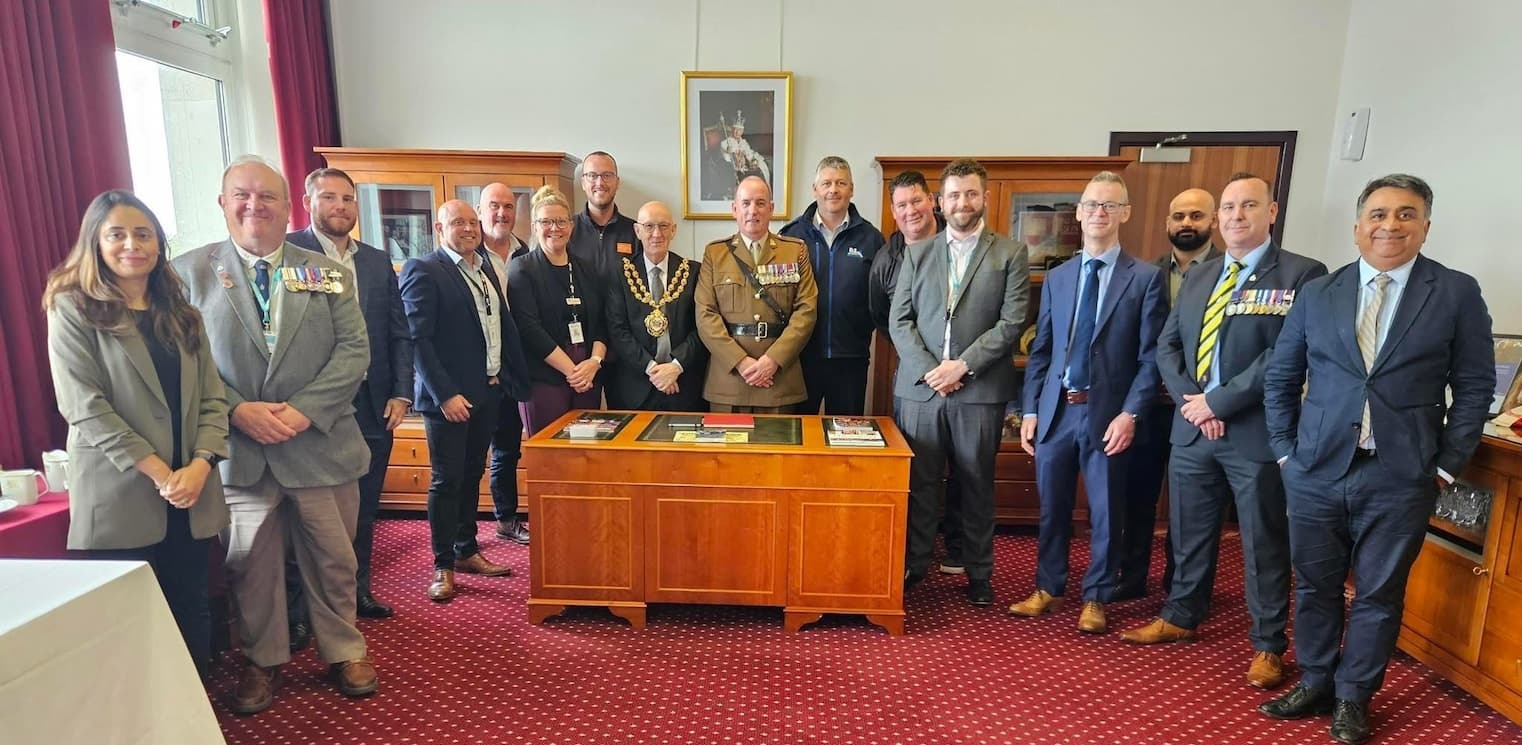  the Mayor of Oldham, Councillor Eddie Moores, Councillor Rustidge, Major Eddy Hardaker and Kash from the Oldham Chamber of Commerce met local businesses pledging support to the Armed Forces community 