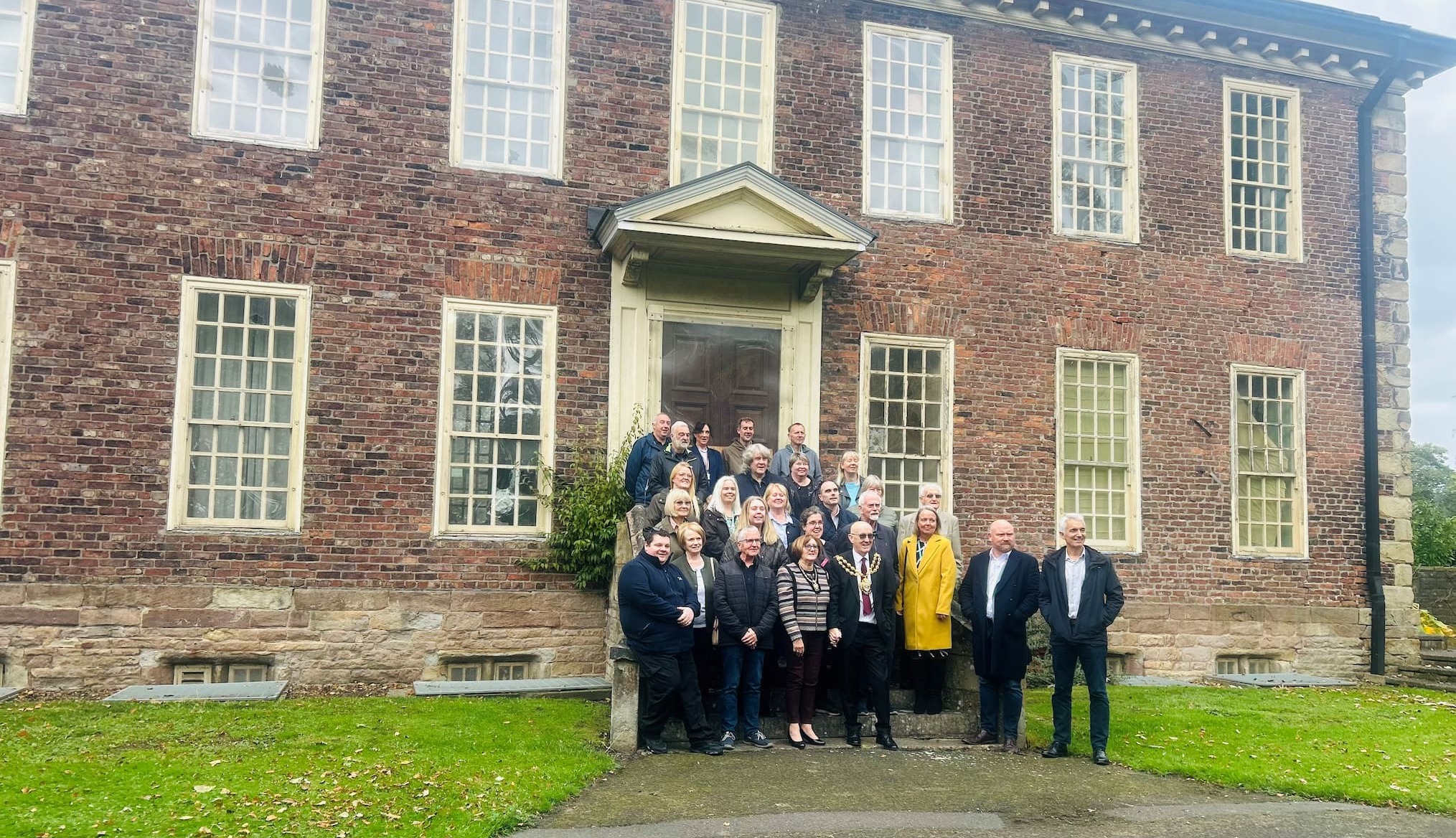 Supporters of the transformation of Foxdenton Hall including Cllr Elaine Taylor and The Mayor of Oldham gather at Foxdenton Hall