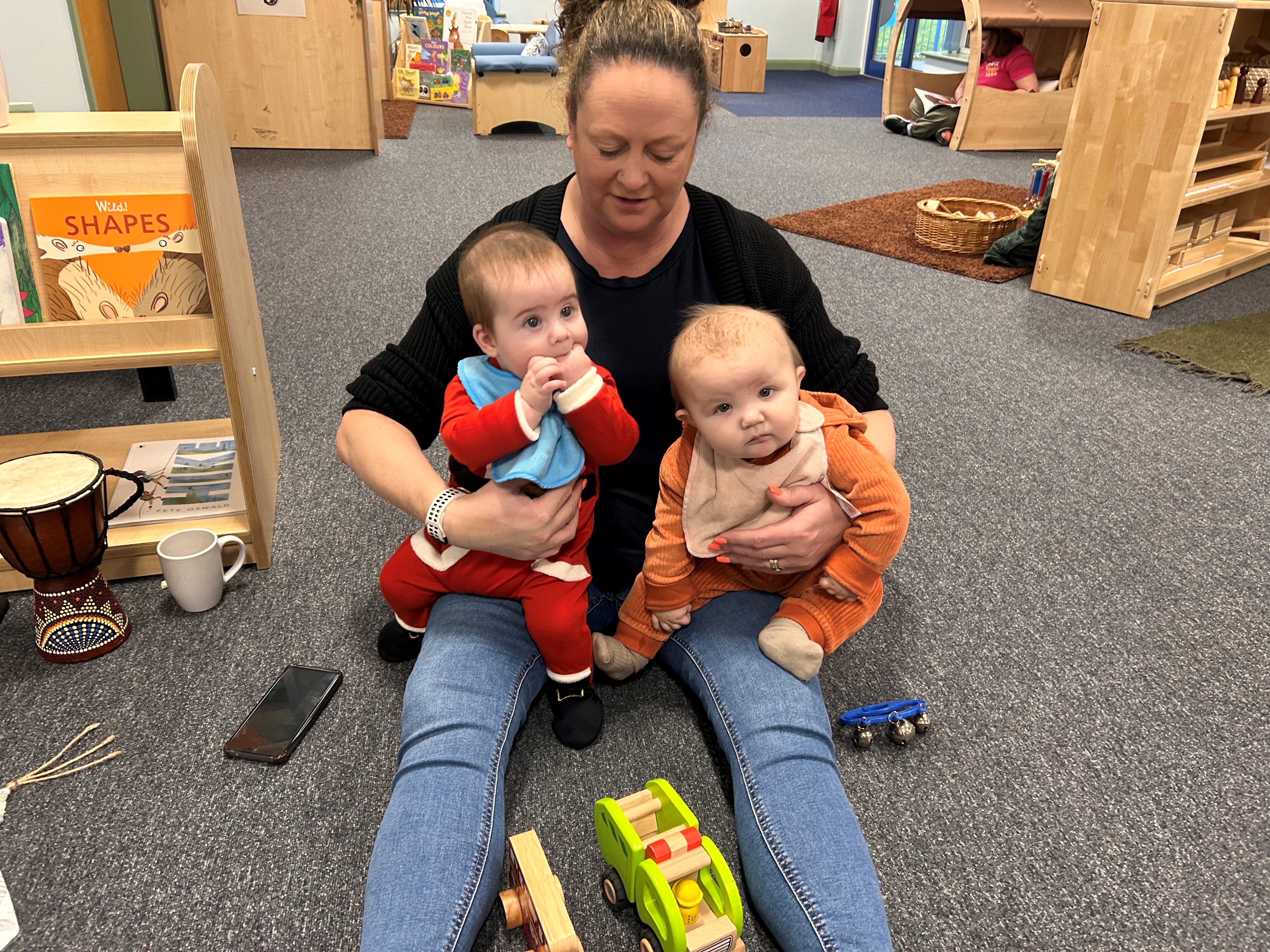 Beever Fanily Hub user cradling two cute babies