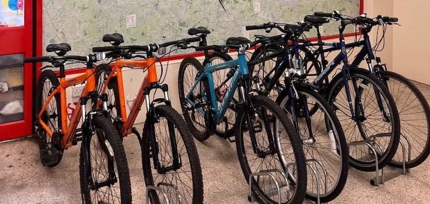 A line up of colourful bicycles