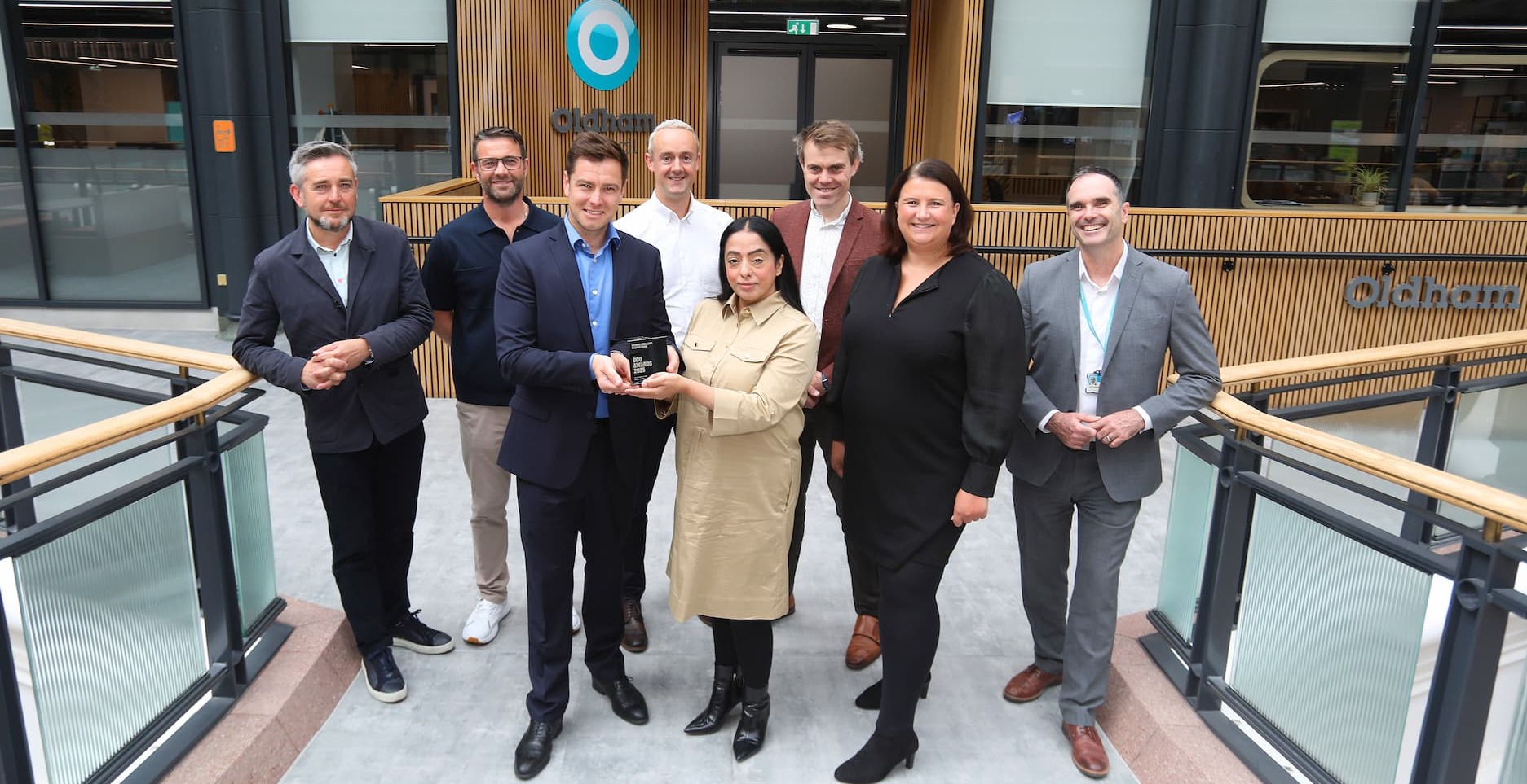The trophy was presented inside the brand-new office space to Leader of Oldham Council Cllr Arooj Shah and Chief Executive Shelley Kipling by representatives from construction company Willmott Dixon, architects AEW, Hive, Gleeds and interior designers SpaceInvader.