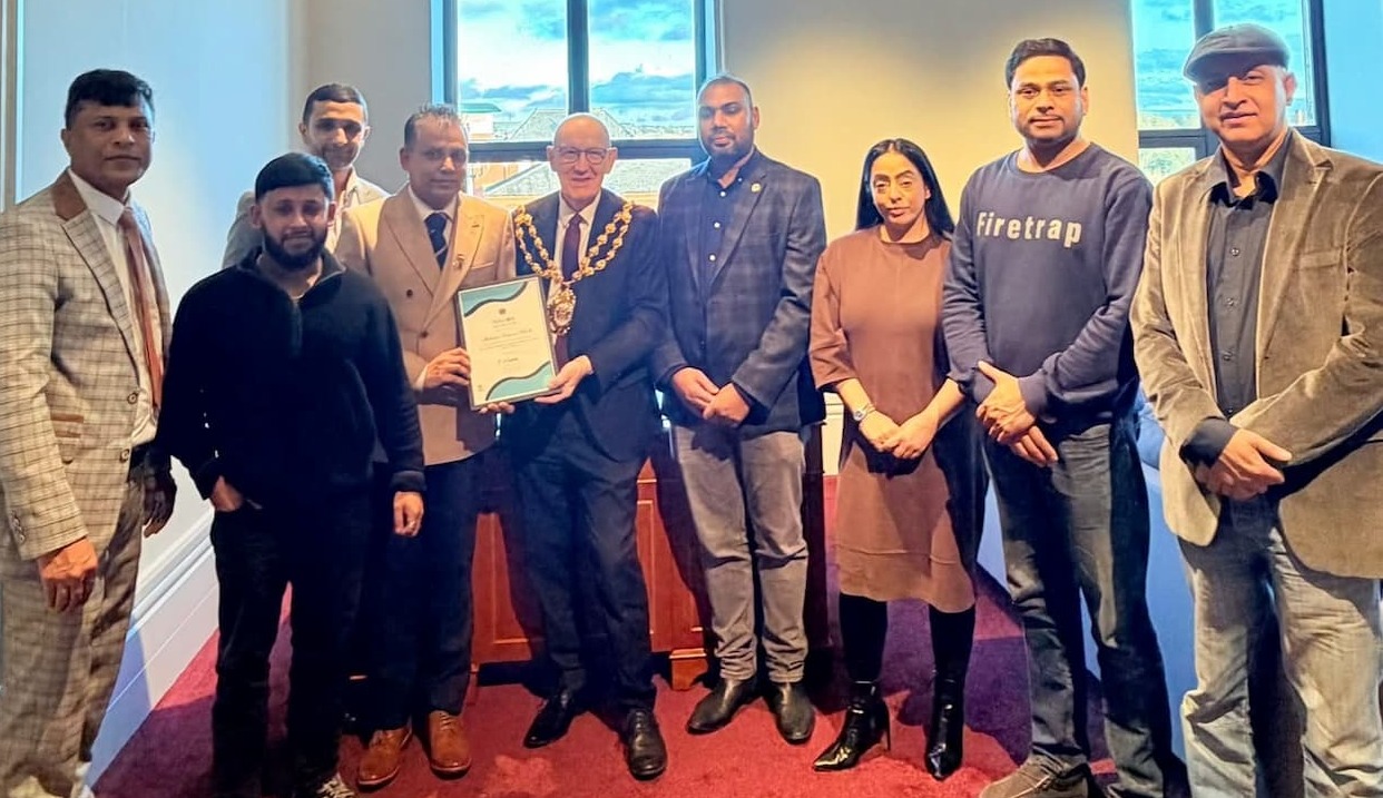 Mayor Cllr Eddie Moores presenting Mahbubur Rahman BEM with a Mayoral Appreciation Award, also attended by Council Leader Cllr Arooj Shah