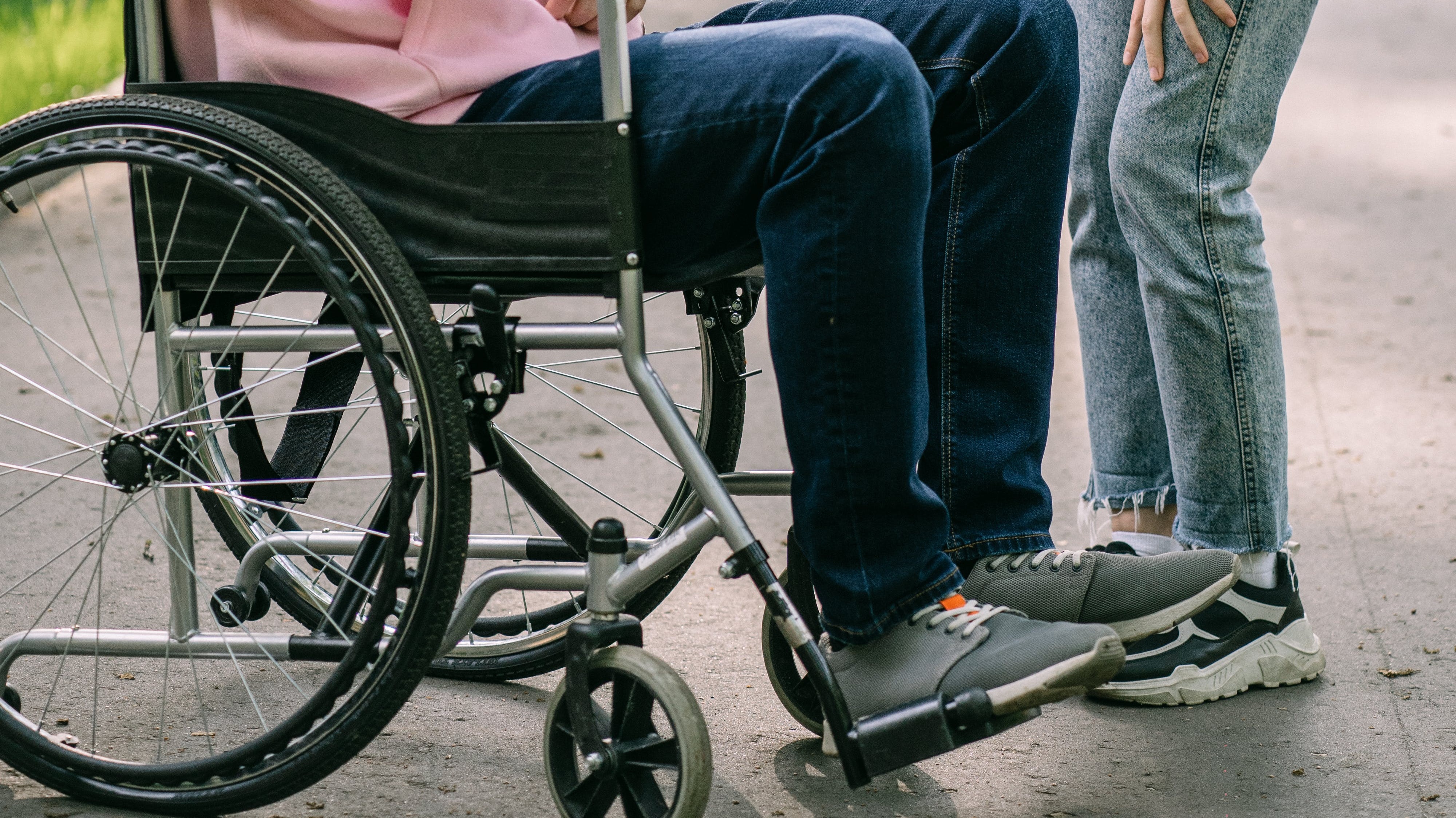Wheelchair and person walking