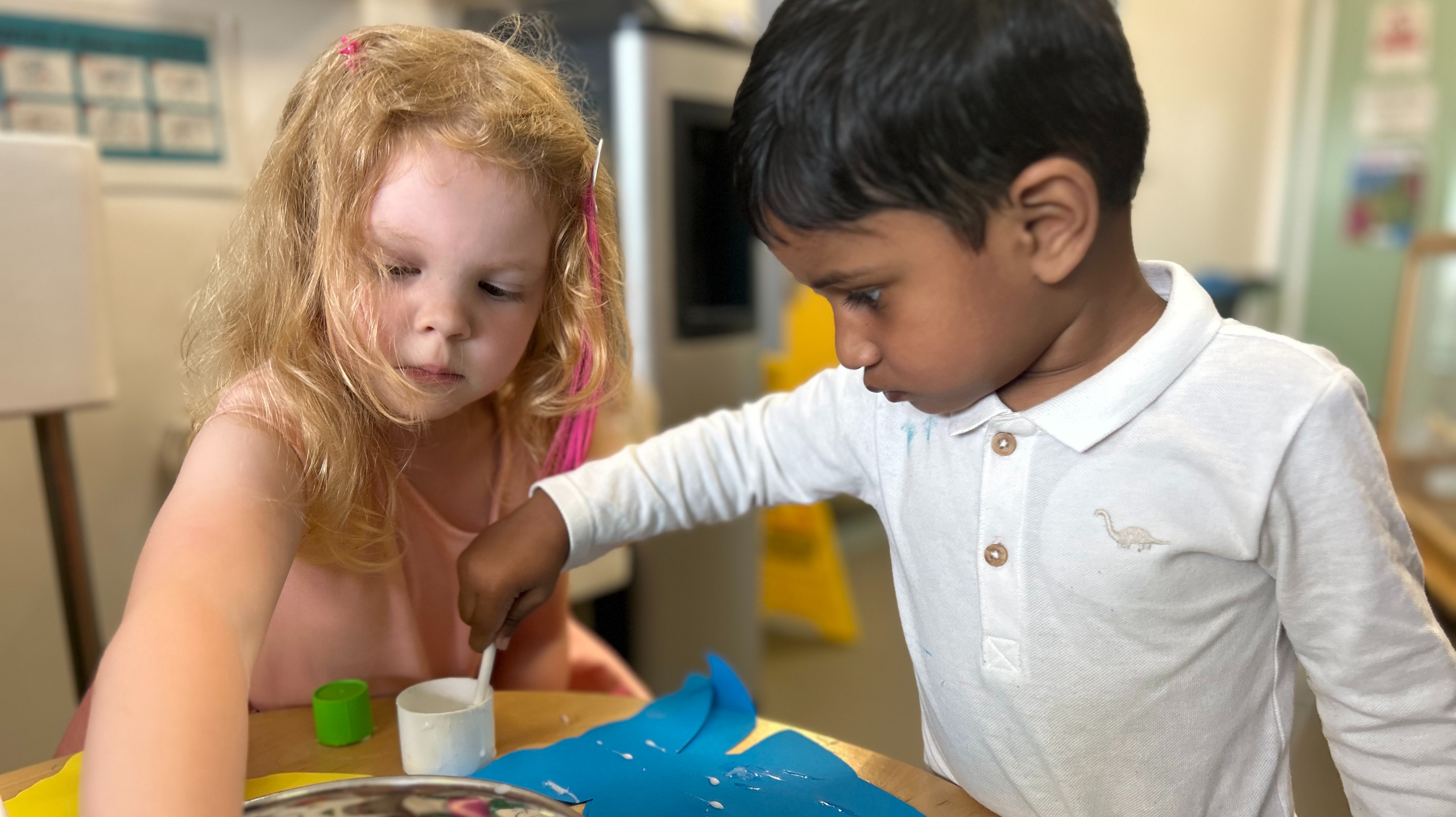 Children making crafts at Medlock Vale Family Hub