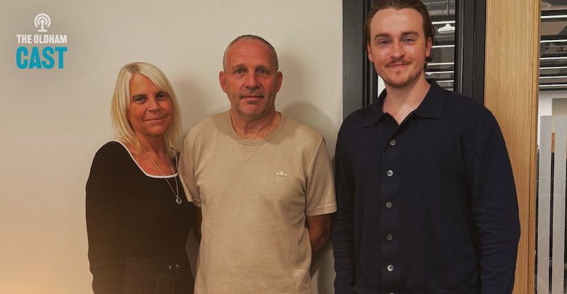 Foster carers Wendy and Paul smiling alongside our Oldham Cast host