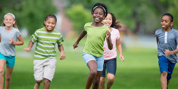 Group of kids running and smiling
