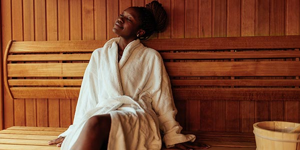 Woman sitting in Sauna