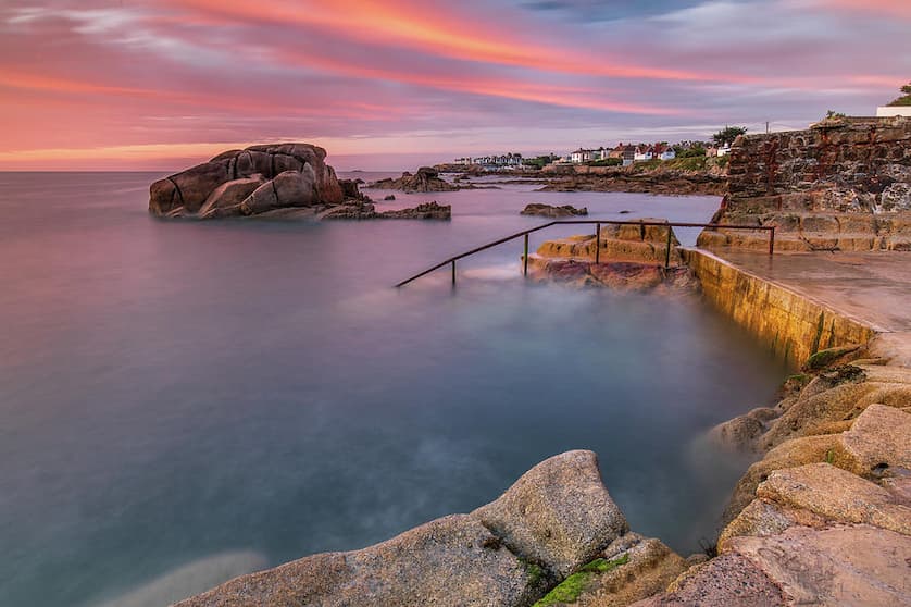 Forty Foot swimming spot at Sandycove, Dublin, with bathers at sunrise