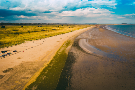 Wooden bridge causeway out to North Bull Island, a UNESCO biosphere reserve in Dublin Bay