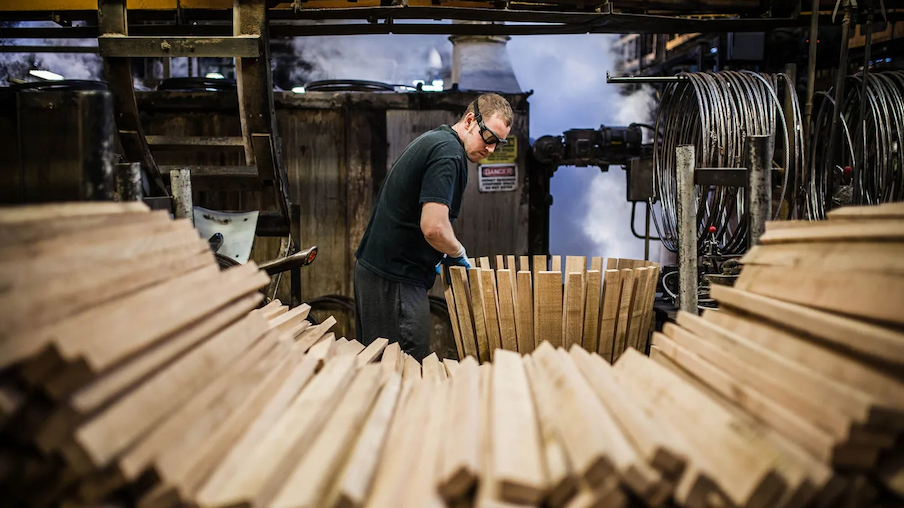 Worker making a barrel in a cooperage